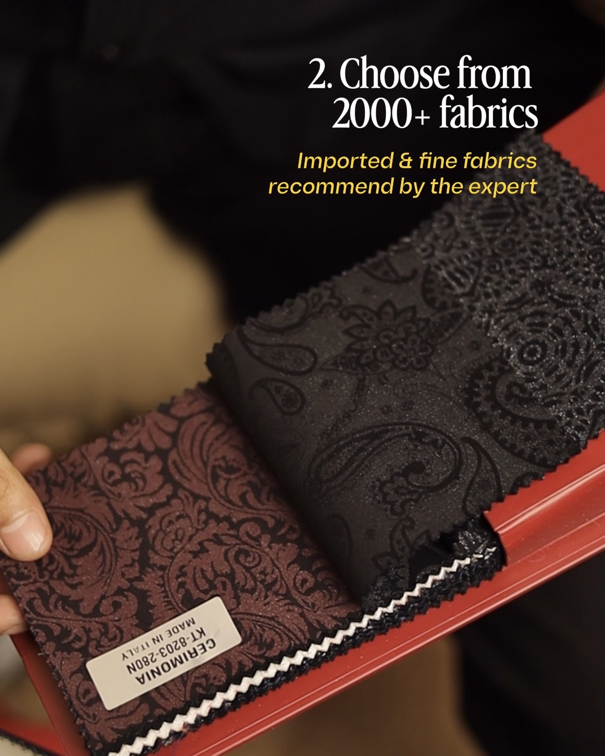 Tailor consulting with client over fabric swatches